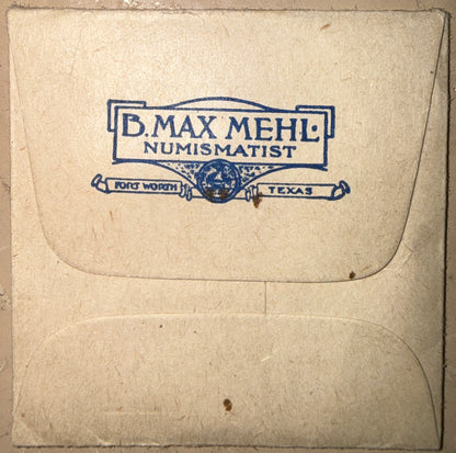 Envelope with 'B. Max Mehl Numismatist' branding on a textured beige background